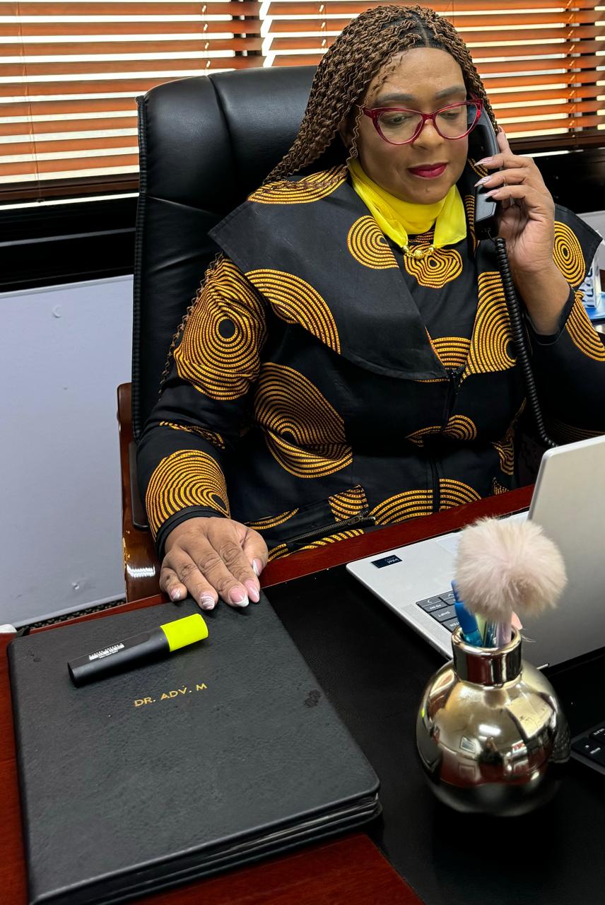 GRC'ore founder at her desk taking a client call